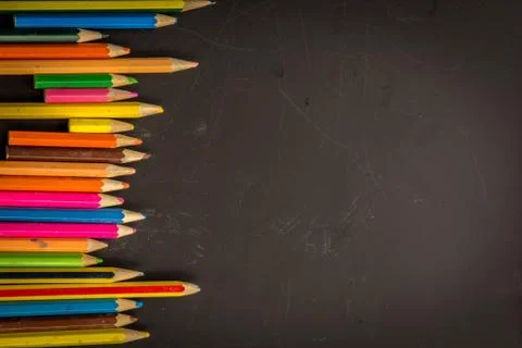Dramatic group of pencils on black or dark background. Stock Photos