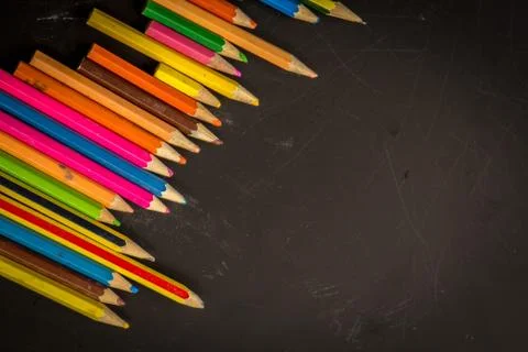Dramatic group of pencils on black or dark background. Stock Photos