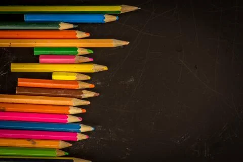 Dramatic group of pencils on black or dark background. Stock Photos