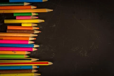 Dramatic group of pencils on black or dark background. Stock-Fotos