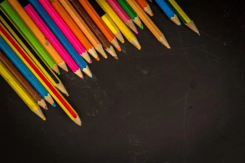 Dramatic group of pencils on black or dark background. Stock Photos