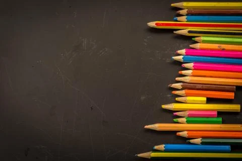 Dramatic group of pencils on black or dark background. Stock Photos