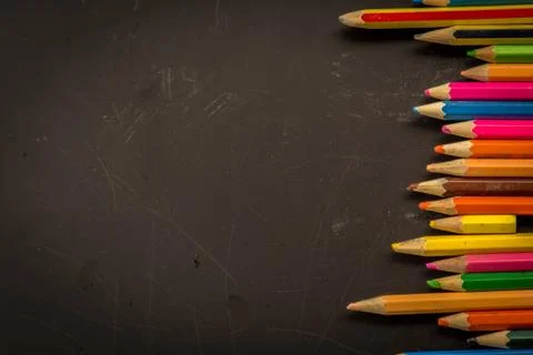 Dramatic group of pencils on black or dark background. Stock Photos