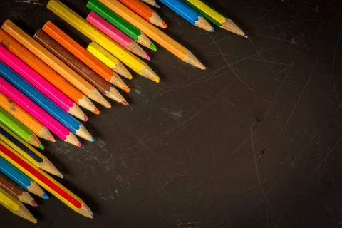 Dramatic group of pencils on black or dark background. Stock Photos