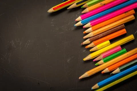 Dramatic group of pencils on black or dark background. Stock Photos