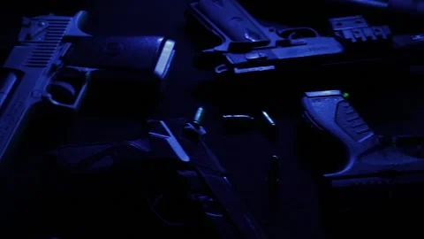 Dramatic Guns on a Table Stock Footage 170158474