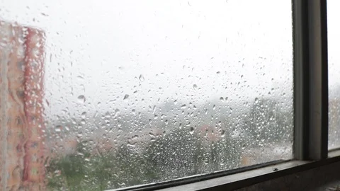 Dramatic hand touches rainy window on a rainy and stormy day 스톡 동영상 91073647