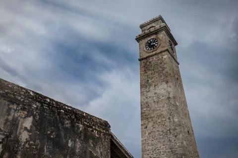 Dramatic heavy sky  with old time tower in Sri Lanka, Galle fort Stock Photos