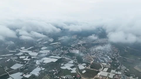 Dramatic Heights: Aerial View of a Picturesque Town in Moody Cinematic Tones Stock Footage 243186502