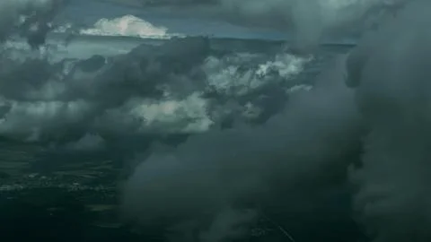 Dramatic High Angle View of Dark Storm Clouds and Foggy Landscape Stock-Fotos