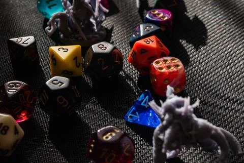 Dramatic High-Contrast RPG Scene with Dice and Miniatures Stock Photos