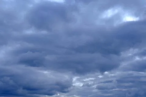 Dramatic high deep blue sky with fluffy clouds, cloudscape in stormy weather 写真素材