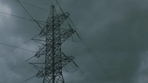 A Dramatic High Voltage Power Line Silhouetted Against the Foreboding Dark Sky B 스톡 동영상 318181833