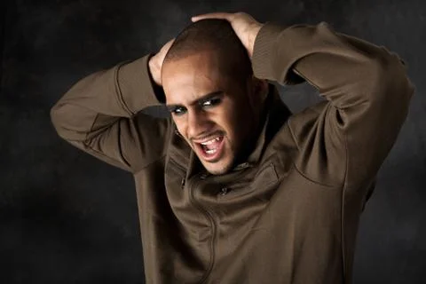 Dramatic Hispanic guy Stock Photos