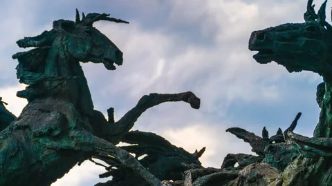 Dramatic Horse Sculptures Passing Clouds Timelapse - La Estampida Sculpture Stock Footage 339763418