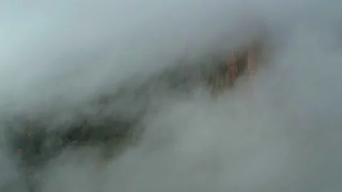 Dramatic hyper lapse of fog moving over mountain peaks, time lapse of weather Stock Footage 165164195