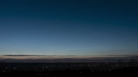 Dramatic hyperlapse of the golden hour of sunset. The image shows the lights of Stock Footage 255459865