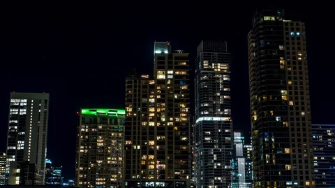 Dramatic Hyperlapse of skyscrapers in city at Night Stock Footage 107174476