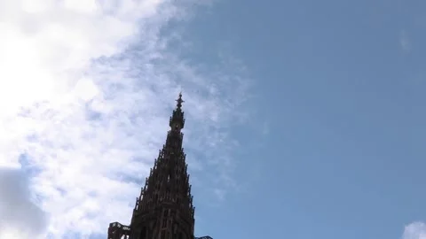 Dramatic Hyperlapse of Strasbourg Cathedral spire under a dynamic sky Stock Footage 318075760