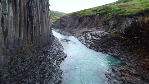 Dramatic Icelandic Canyon Basalt Columns Turquoise River Stock Footage 329440515
