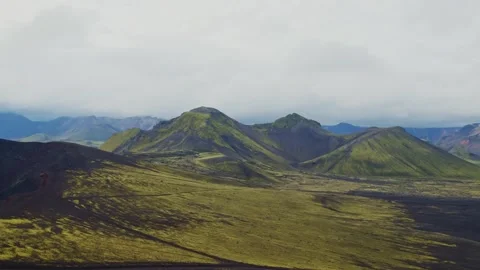 Dramatic Icelandic Highlands Landscape with Volcanic Mountains and Mossy Terrain Stock Footage 320512313