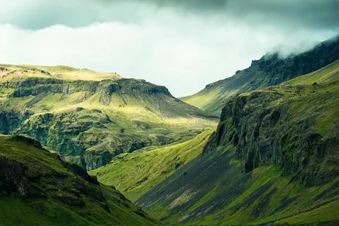 Dramatic Icelandic mountain with sunlight shining in summer Stock Photos