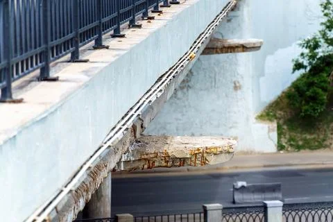 Dramatic image of collapsing concrete pillars of a car bridge over a road. Sy Stock Photos