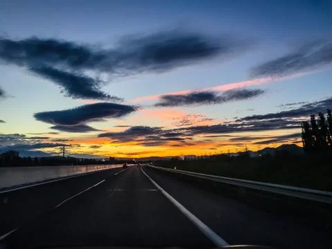 Dramatic image of Panoramic view with A long curve road in the early morning  Stock Photos