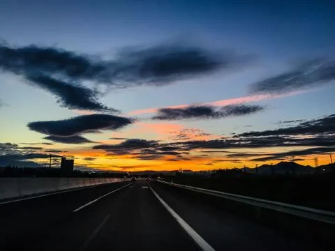 Dramatic image of Panoramic view with A long curve road in the early morning  Stock Photos