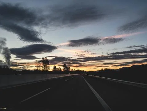 Dramatic image of Panoramic view with A long curve road in the early morning Stock Photos