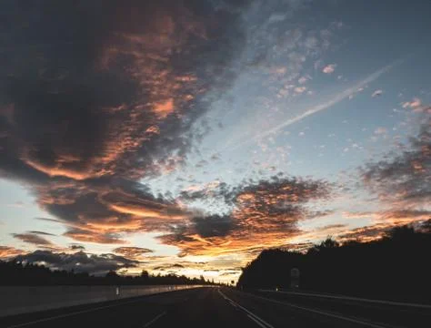 Dramatic image of Panoramic view with A long curve road in the early morning Stock Photos