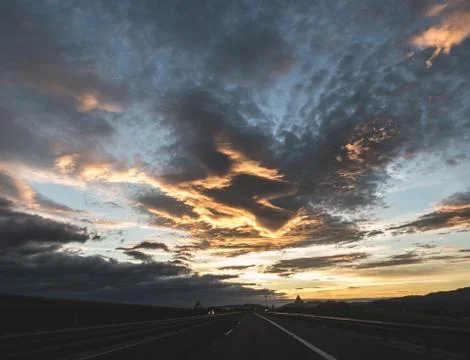 Dramatic image of Panoramic view with A long curve road in the early morning Stock Photos