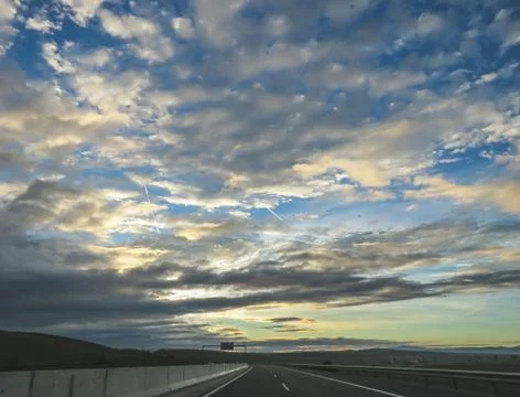 Dramatic image of Panoramic view with A long curve road in the early morning Stock Photos