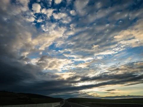 Dramatic image of Panoramic view with A long curve road in the early morning Foto stock