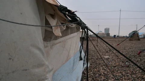 Dramatic image of a Tent in a refugee camp. Raining in Slow Motion. Mosul. Stock Footage 158379928