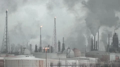 Dramatic industrial background of oil refinery with smoking and flaming pipes. Stock Footage 140218894