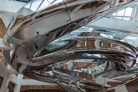 The dramatic interior of the Fenix Museum Rotterdam's "Tornado" staircase, .. Foto stock