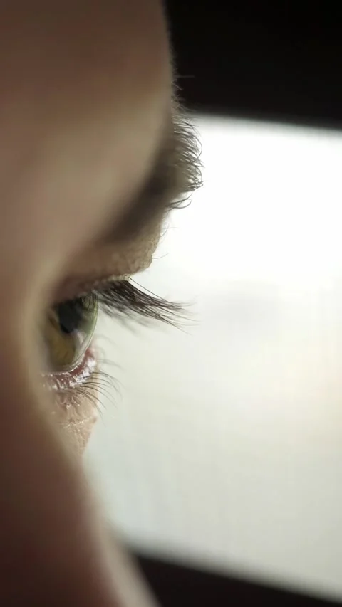 Dramatic isolated portrait of a man who opens his eyes and looks out window Stock Footage 346018948
