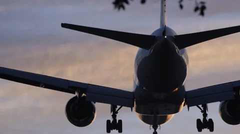 DRAMATIC JET LANDS AT SUNSET 2 Stock Footage 63319853