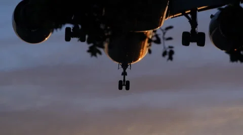 DRAMATIC JET LANDS AT SUNSET 3 Stock Footage 63319973