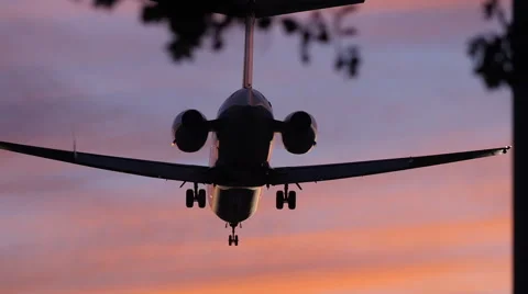 DRAMATIC JET LANDS AT SUNSET Stock-Footage 63319870