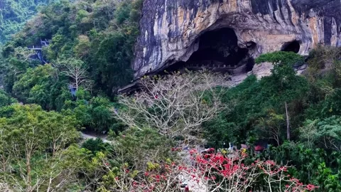 Dramatic Karst Mountain Landscape with Large Cave Opening China Stock Footage 346333744