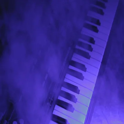 Dramatic Keyboard Playing with Changing Colored Lights 2 Stock Footage 69692981