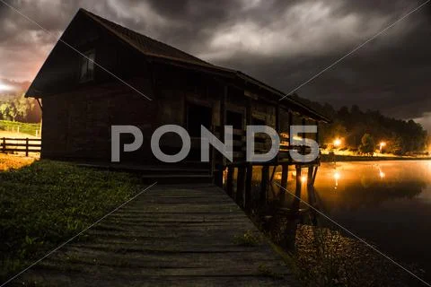Dramatic lake house Stock Photos