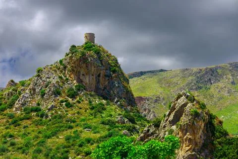 Dramatic landmark watch tower on a top of mountain moody overcast cloudy we.. Фото