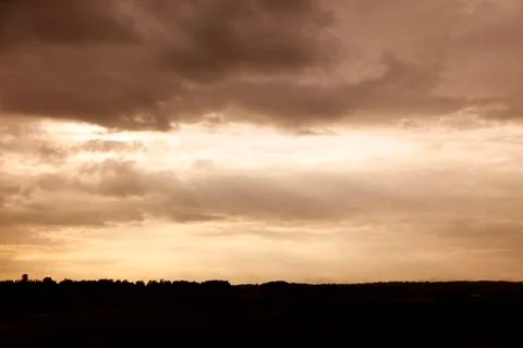 Dramatic landscape in backlight with sunset over Roback in Umea Stock Photos