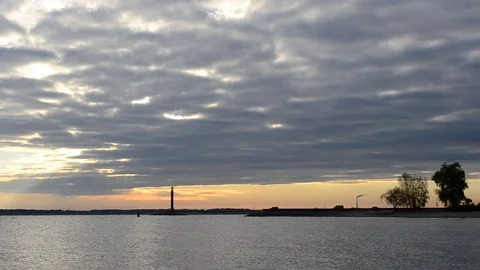 Dramatic landscape with birds flying over water Stock Footage 72916953