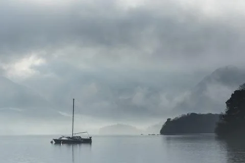 Dramatic landscape image looking across Derwentwater in Lake District towards Stock Photos