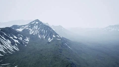 Dramatic landscape of peaks of the high Caucasus mountains and white snow Illustrazione stock