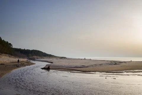 Dramatic landscape with a river winding through a sandy expanse towards the s Foto stock